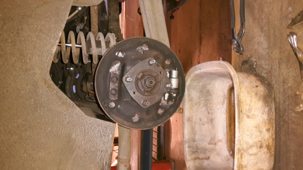 Hub and brake shoes removed. Also brake pipes and handbrake cables removed