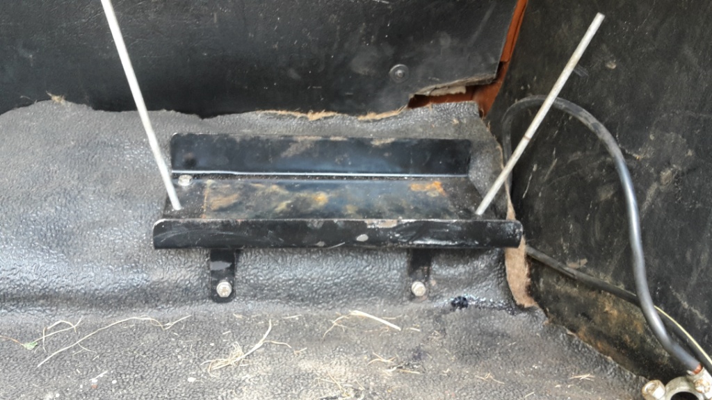 Carpet under battery tray