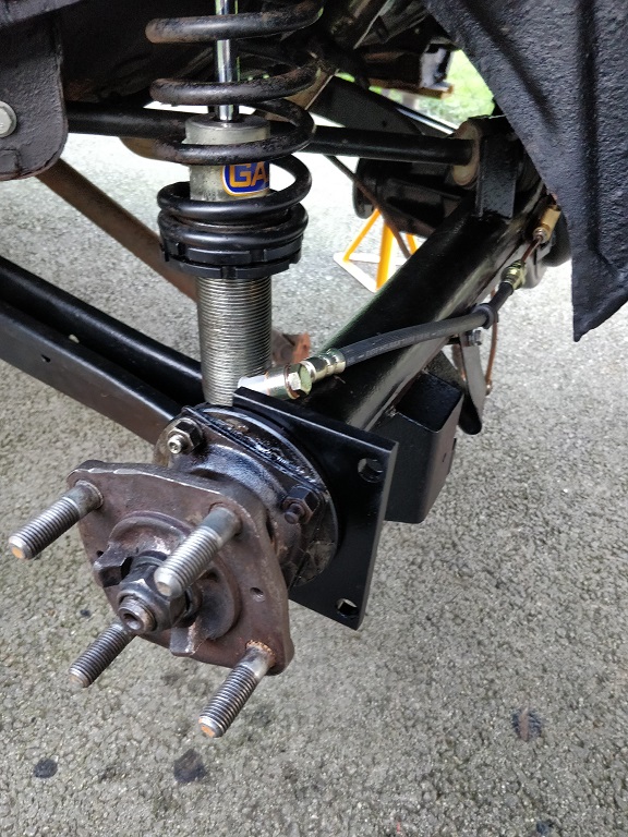 Axel fitted to car with bracket.jpg