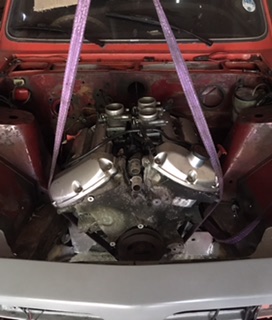 Engine in, and sitting nicely. Does need to drop about 2-3 inches as the throttle bodies stick into the bonnet slightly