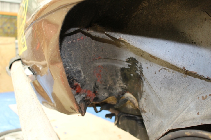 Where the wheel exited - rear of wheel arch and under car
