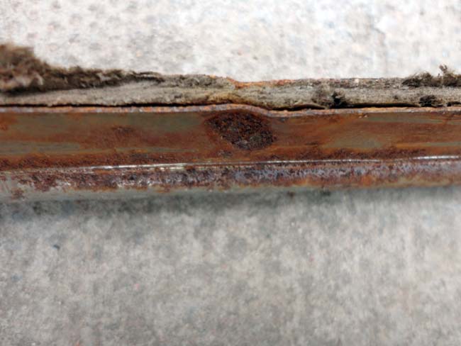 View of the spot-weld with the hardboard cut away