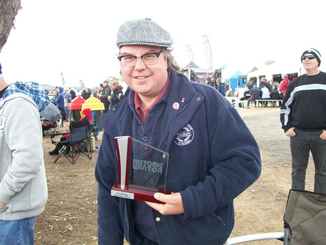 Trophy for most ridiculous hat and also something about the car as well.