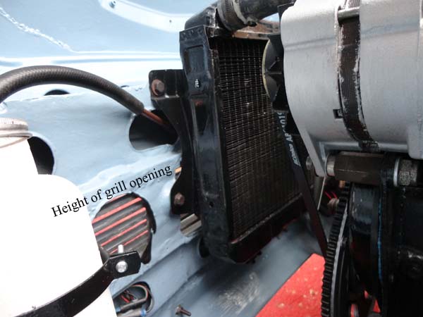 The inside view showing position of grill and where it feeds air to lower section of radiator