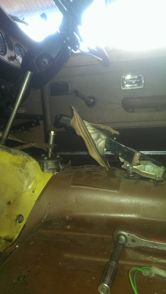 handbrake lever with spacers under front will clear gear linkage, just need to mske new angled mounting plate