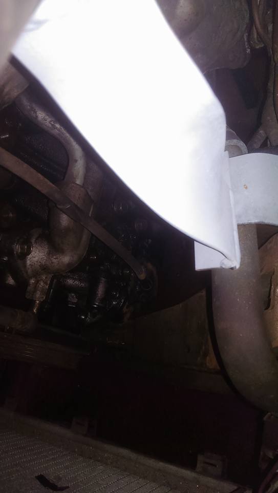 air filter bracket, bottom radiator hose braket and you can just see the dip stick